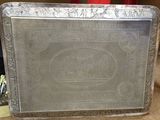 a silver tray with a picture of a man and a woman on it