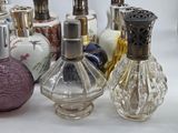 a lot of perfume bottles that are sitting on a table