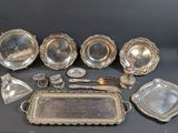 a lot of silver items that are on a table