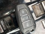 a close up of a car ' s interior with a remote control