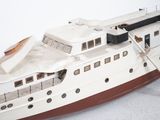 a model of a boat on a white surface