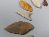 five different types of stones on a gray surface