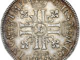 an old silver coin with a cross on it