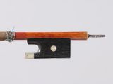 a bow that is attached to a piece of wood