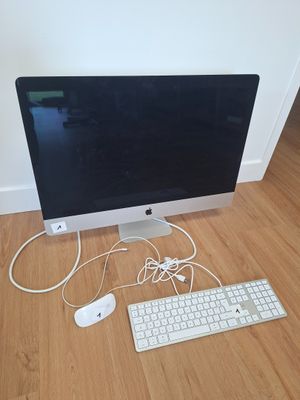 a computer monitor, keyboard, mouse and mouse on the floor