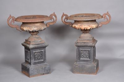 two vases sitting on top of each other on a table
