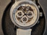 a watch that is in a box on the table