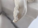 a close up of a statue of a hand holding something