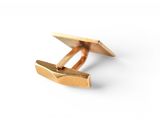 a close up of a pair of gold cufflinks on a white background