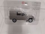 a toy car in a clear box on a table