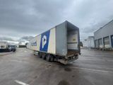 a semi truck that is parked in a parking lot