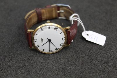 a watch that is sitting on a table with a price tag attached to it