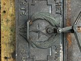 a close up of a fire hydrant with a clock on it