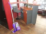 a mop that is sitting on the floor in front of a counter