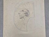 une image représentant le dessin d'une tête d'homme sur une feuille de papier