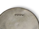 an antique silver plate with two buttons on the front