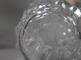 a close up of a glass vase on a table