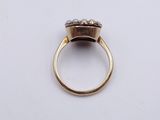 an image of a gold ring with two diamonds on it