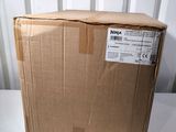 a box that is sitting on a table in front of a wall