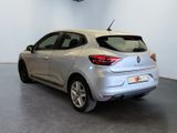 the rear end of a silver car in a showroom