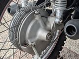 a close up of a motorcycle tire with a chain on it