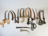a lot of different types of knives on the table