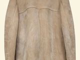 beige sheared coat with a hood on a mannequin mannequin mannequin mannequin mannequin mannequin mannequin manne