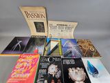 several books are stacked on top of each other on a table