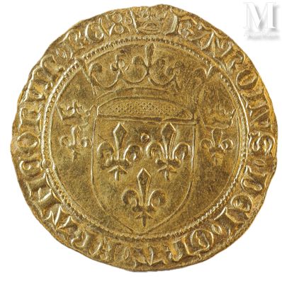 a close up of a gold coin with a crown on it