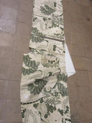 an image of a long table runner with a floral design on it