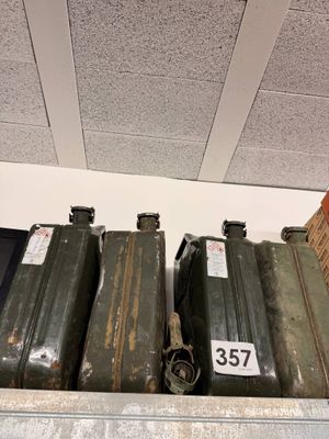 a shelf that has a bunch of old suitcases on it