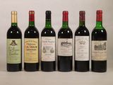 plusieurs bouteilles de vin sont alignées sur une table