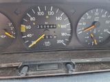 a close up of a car dashboard with various gauges