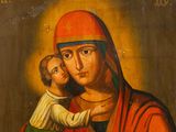 an old painting of a woman holding a child in her arms
