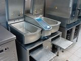 a lot of sinks that are in a public restroom