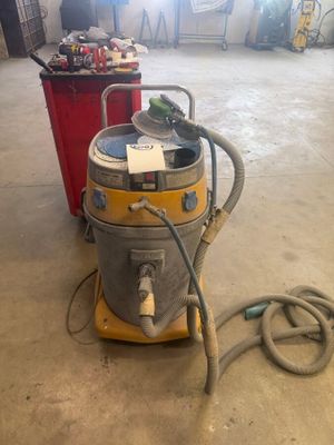 an image of a wet dryer sitting on top of a cement floor