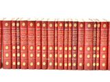 the twelve books are lined up in a row on a white surface