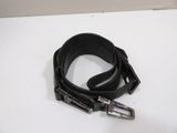 a black belt with a metal buckle on a white surface
