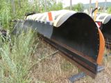 two large metal pipes sitting in the middle of a field