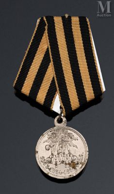 une image représentant une médaille ornée d'un ruban noir et or