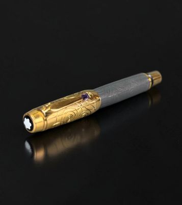 a pen that is sitting on a black surface