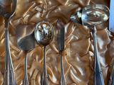 five spoons and two spoon spoons on a table