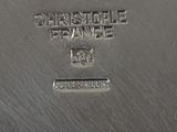 a close up of a silver plate with a name on it