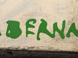 a graffiti on the side of a building that says,