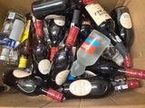 a cardboard box full of bottles of alcohol and liquor