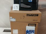 two boxes with a printer on top of them on a table