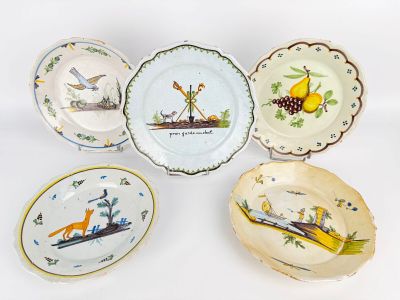 several plates with different designs and designs on them on a white surface