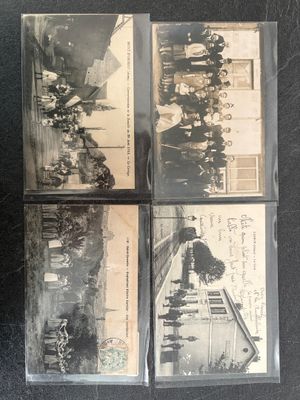 four old black and white photos of a group of people on a street