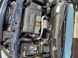 an overhead view of a car with its hood open showing the engine compartment