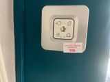 a blue refrigerator with a sticker on the door